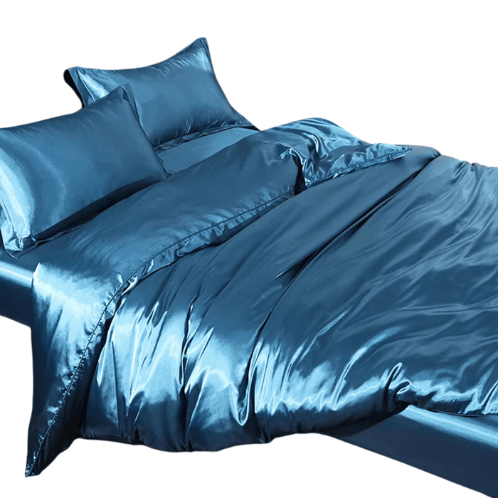 Luxury satin bedding set in peacock blue with duvet cover, fitted sheet, and pillowcases