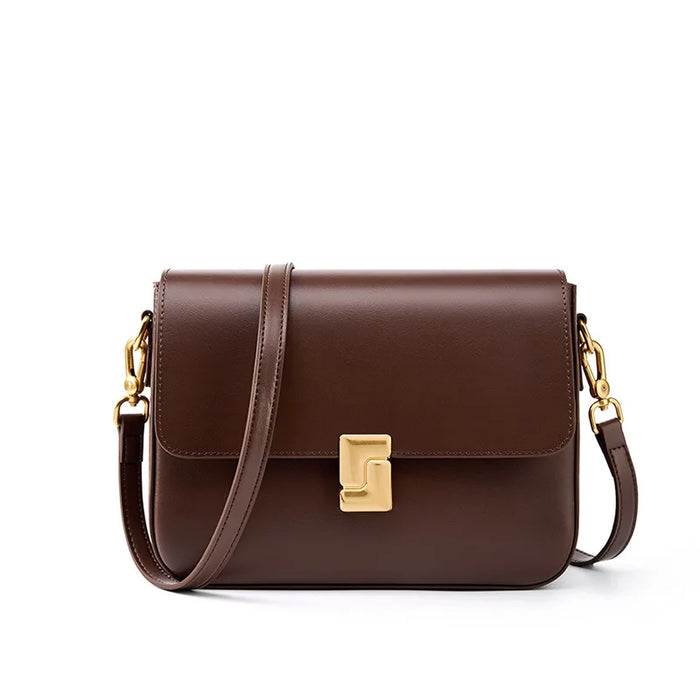 Women's brown cowhide leather crossbody handbag with adjustable shoulder strap
