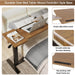 Adjustable overbed table with hidden rolling wheels, perfect for laptop use