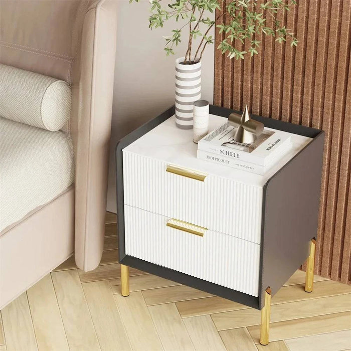 Modern white bedside table with drawers, perfect for bedroom storage and organization