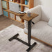 Adjustable overbed table with hidden rolling wheels in stylish brown finish