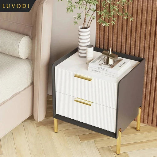 Modern white bedside table with drawers and ample storage space for bedroom organization