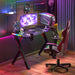 Black gaming desk with dynamic RGB LED lights and sturdy metal legs