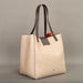 Elegant geometric patterned handbag with a stylish cover closure
