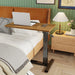 Adjustable overbed table with hidden rolling wheels in stylish brown color
