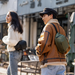 Camera sling bag with customizable compartments and secure storage