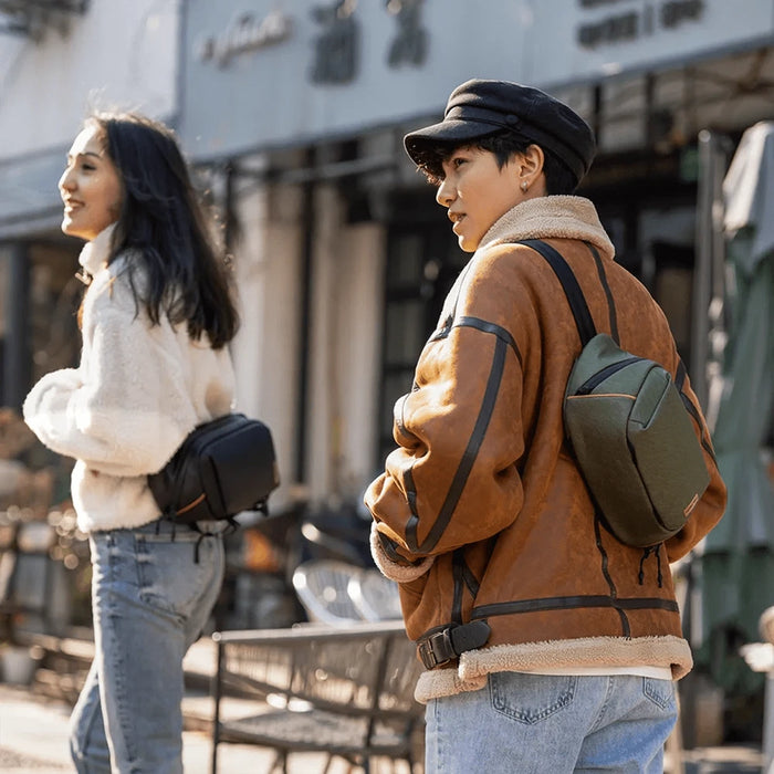 Camera-sling-bag-with-customizable-compartments-for-camera-and-lenses