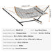 Sturdy hammock with hardwood spreader bars, handcrafted ropes, and powder-coated steel stand