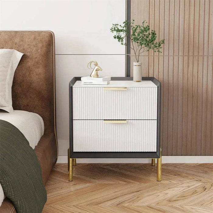Modern white bedside table with drawers, ideal for stylish storage solution in bedroom