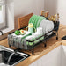 Expandable black dish drying rack with drainboard and swivel spout