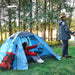 Two-person green winter camping tent with snow skirt in 4-season backpacking shelter