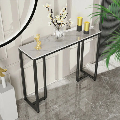 Minimalist console table with dark marble top and sleek black metal legs