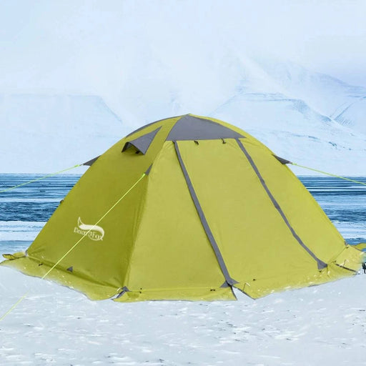 Two-person green winter camping tent with snow skirt, ideal for 4-season backpacking shelter