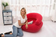 Red portable inflatable armchair with U-shaped design for camping and outdoor use