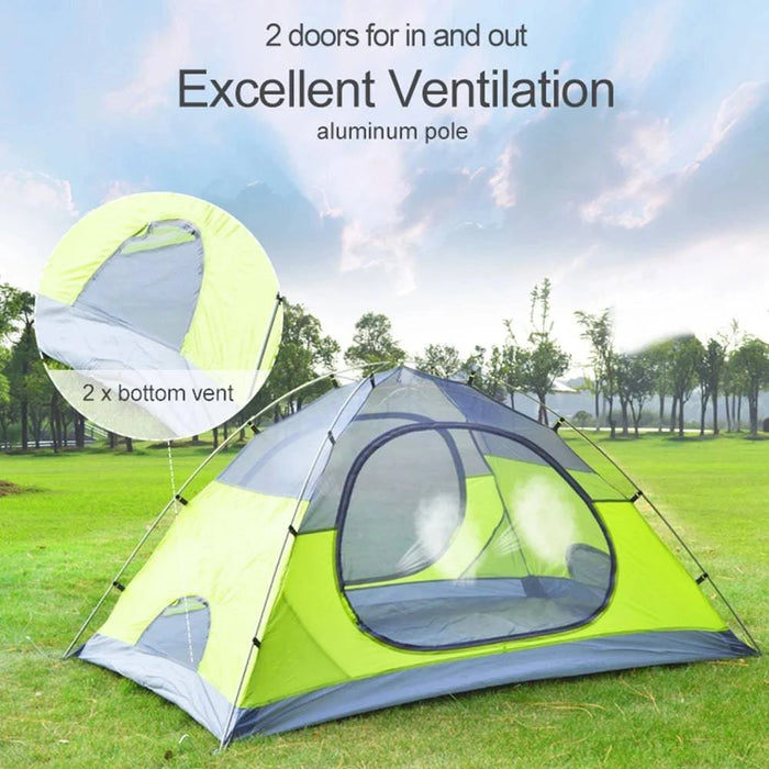 Two-person green winter camping tent with snow skirt and 4-season backpacking shelter in snowy landscape