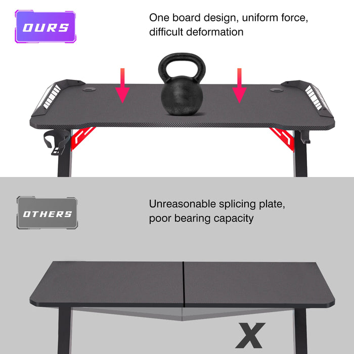 Black gaming desk with dynamic RGB LED lights and sturdy metal legs