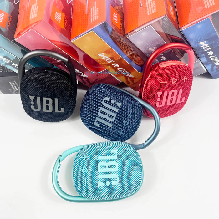 Portable Bluetooth speaker with charging cable and user manual for home or on-the-go use