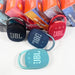 Portable Bluetooth speaker with charging cable and user manual for home or on-the-go use