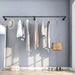 Space-saving black wall-mounted clothes rail for maximizing closet space