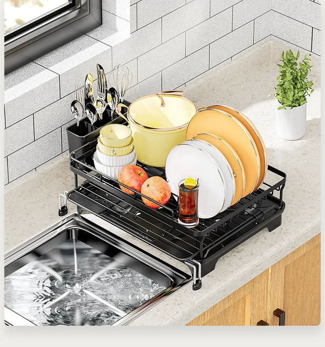 Black expandable dish drying rack with drainboard and utensil holder