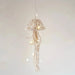 Geometric and whimsical handwoven design in natural colours